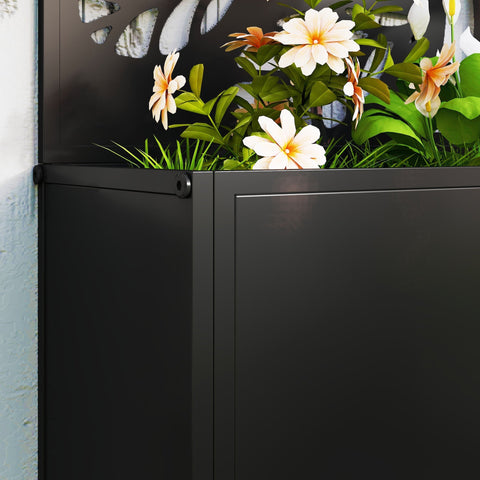 Outsunny black powder coated metal planter with leaf cut-out trellis filled with green grass and white peach flowers