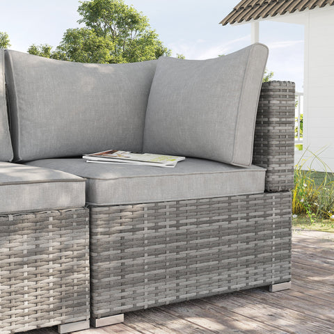 Gray woven rattan corner sofa with matching light grey seat cushions perfect for outdoor garden seating