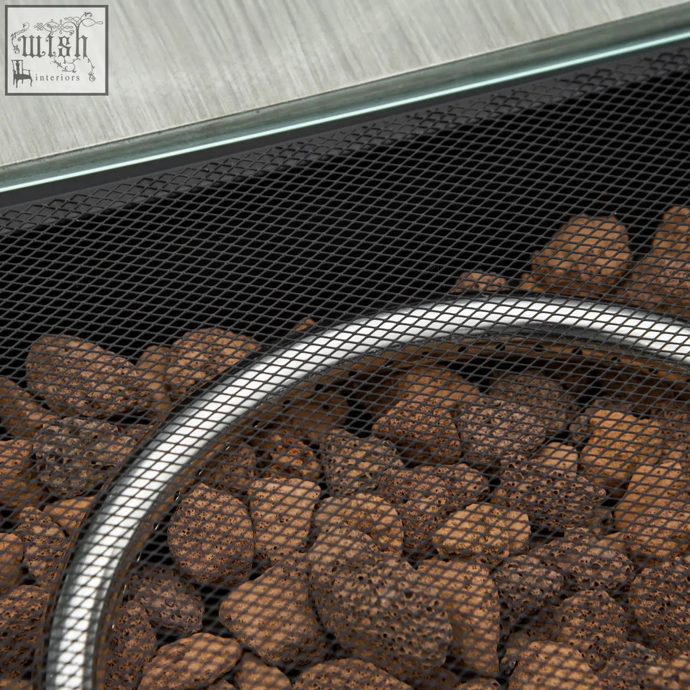 Black mesh screen with silver rim holding brown lava rocks in outsunny grey rattan pit table with btu burner and rain cover