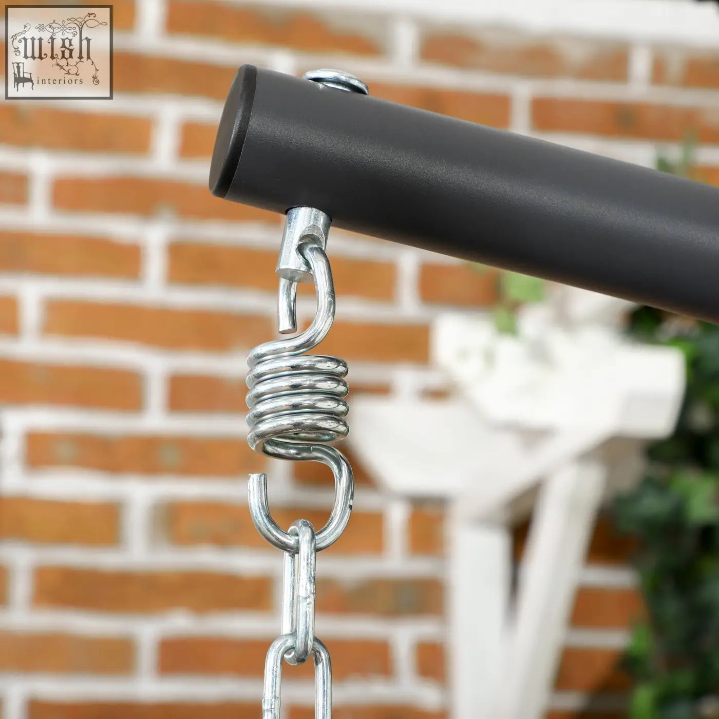 Black metal swing arm with silver spring and chain attachment on outsunny hanging egg chair with powder coated steel frame