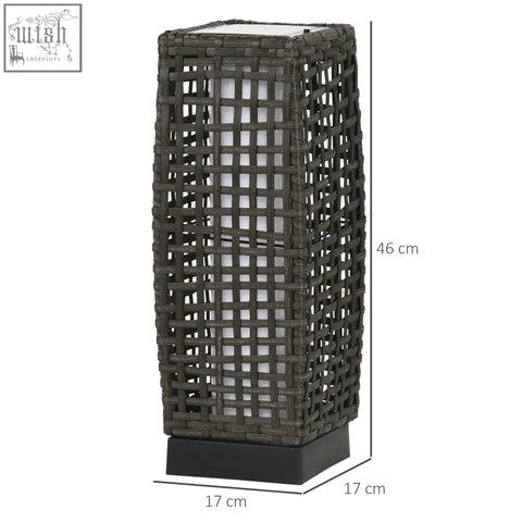Dark gray woven rattan lamp with solar panel and black base provides up to eight hours light for outdoor use