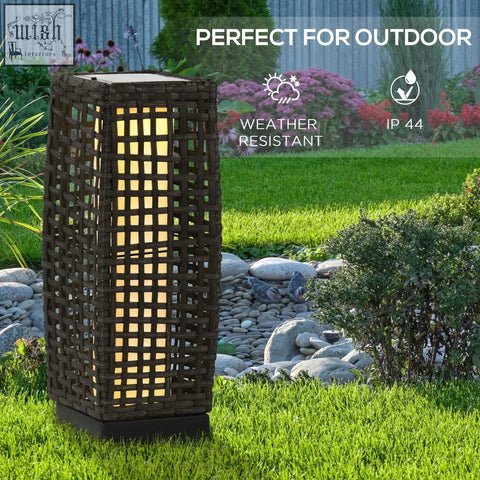 Dark brown woven rattan lamp outdoor solar lantern with warm yellow glow offers eight hours light for patio garden use