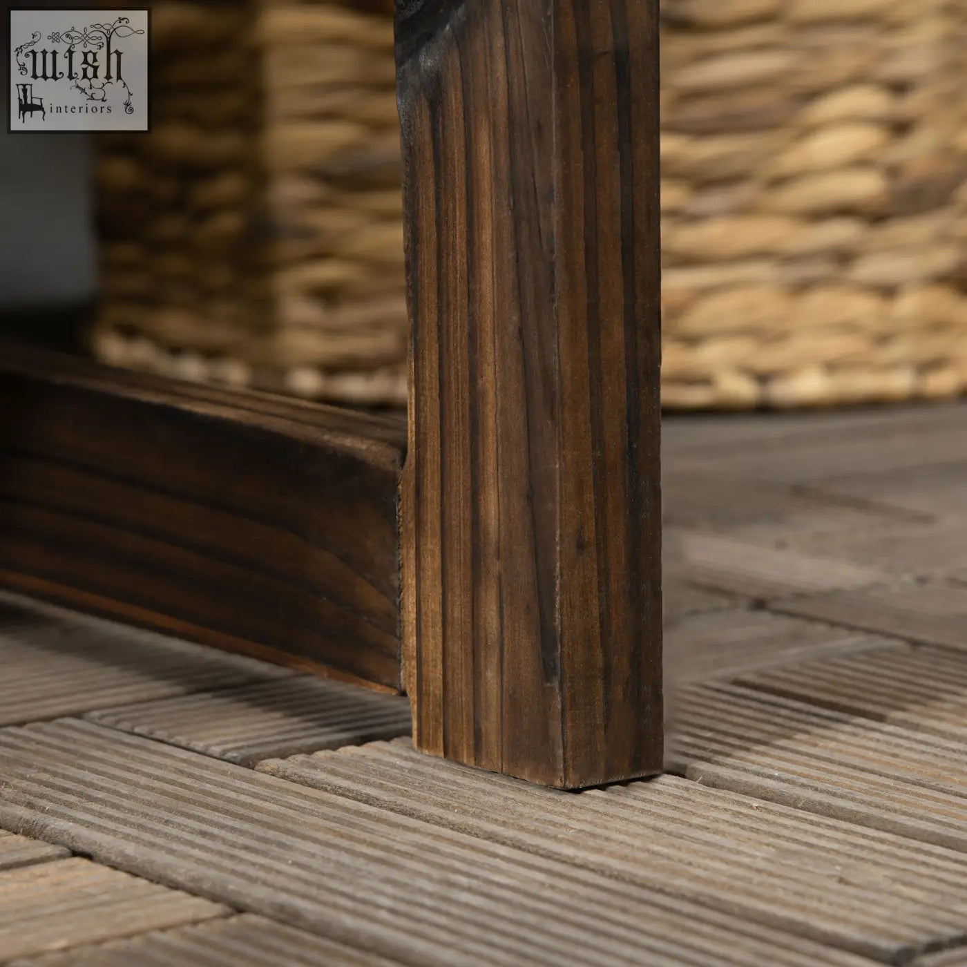 Dark brown solid fir wood table leg with vertical grooves and rustic carbonised finish on outsunny outdoor bench