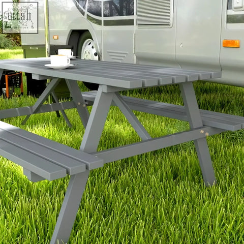 Gray plastic picnic table with attached benches featuring a parasol hole for outdoor garden patio use