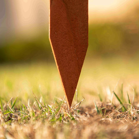 Rusty metal garden marker with pointed tip and textured surface for outsunny fir wood border fences in brown