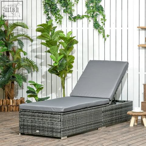 Gray woven rattan sun lounger with soft padded cushion and adjustable recliner perfect for patio or garden use