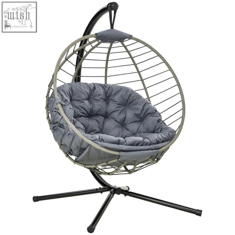 Gray cushioned outsunny swing chair with foldable basket, woven wire frame, and black metal stand for indoor and outdoor use