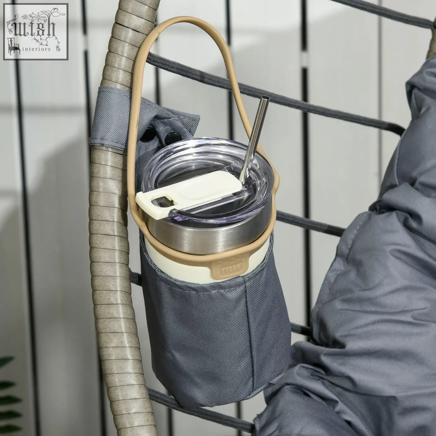 Gray fabric cup holder with beige strap and metal clasp on outsunny swing chair with padded cushion and foldable basket