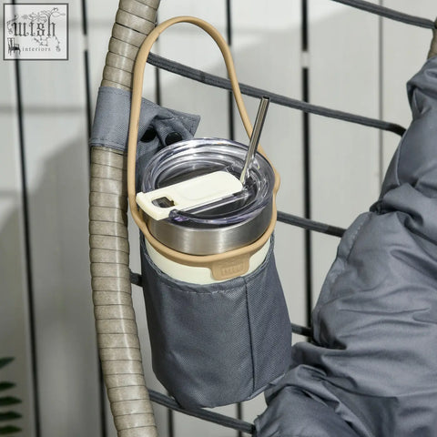 Gray fabric cup holder with beige strap and metal clasp on outsunny swing chair with padded cushion and foldable basket