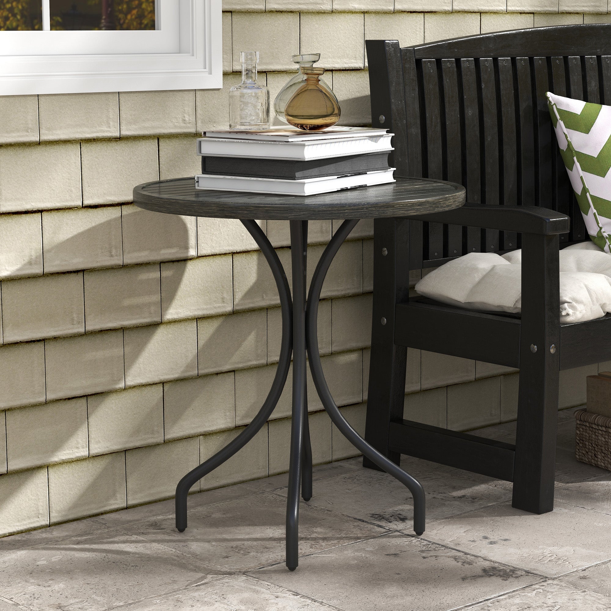 Dark gray round garden table with galvanised steel frame and textured tabletop perfect for outdoor use