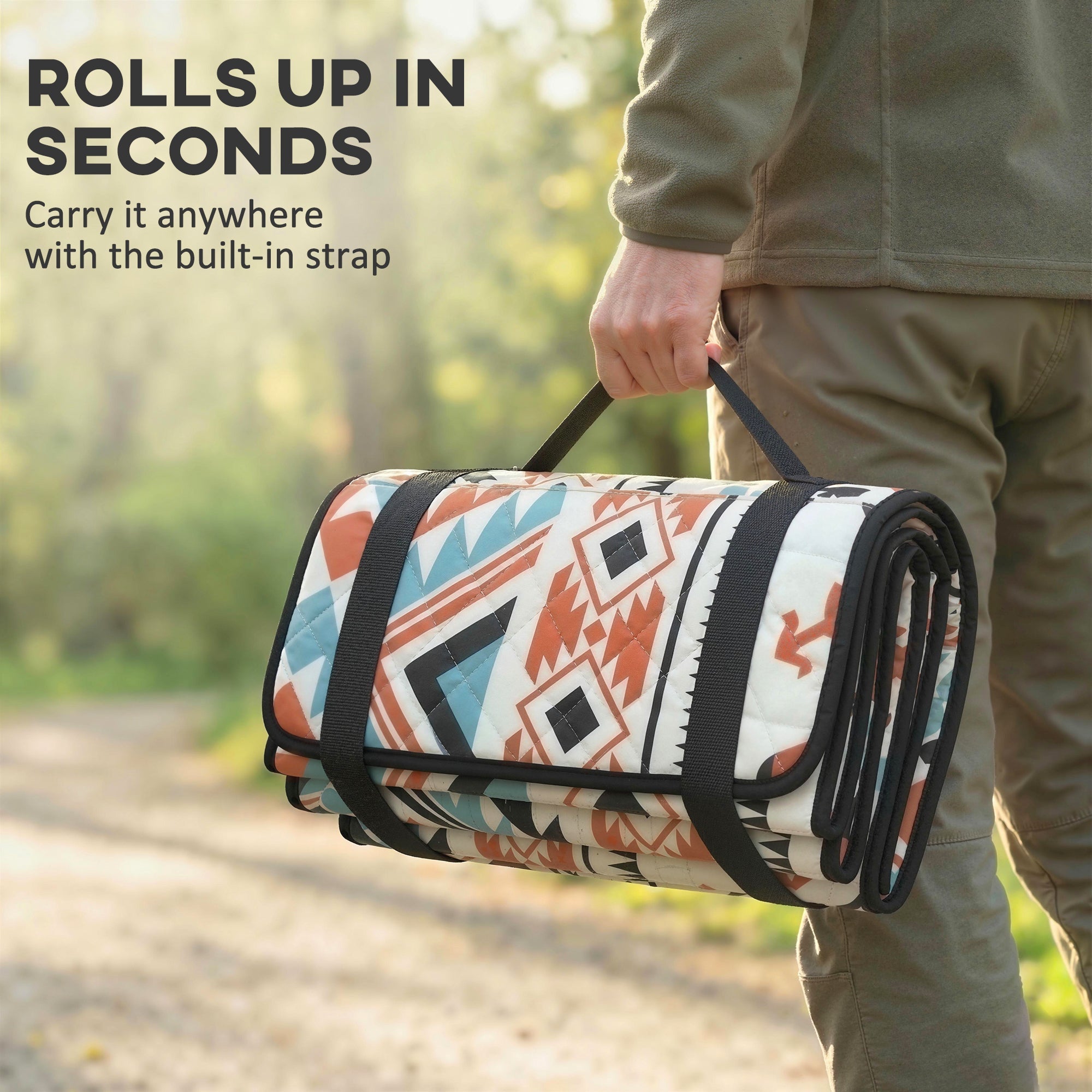 Rolled-up outsunny picnic blanket with orange teal geometric pattern and integrated strap camping mat for outdoor use