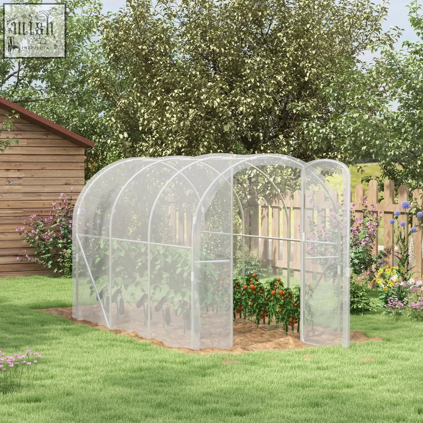 Clear polytunnel greenhouse with galvanised steel frame and transparent cover in a garden setting