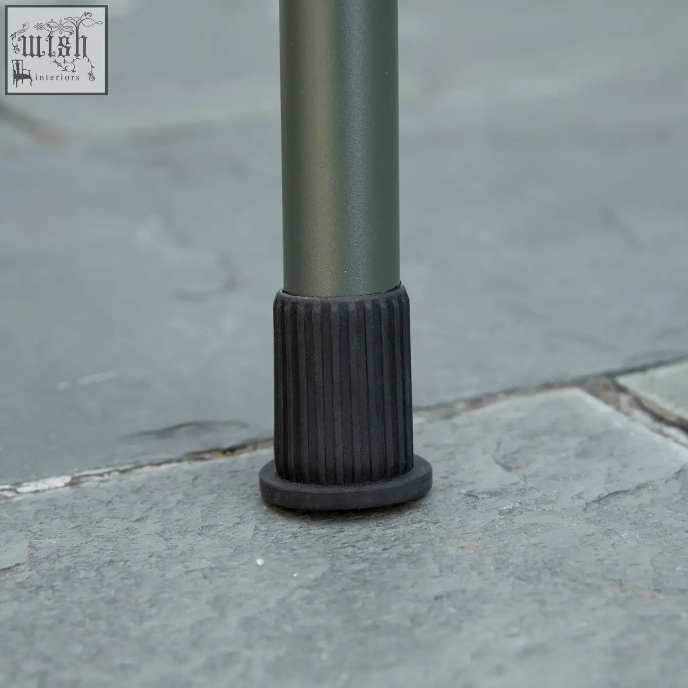Black rubber foot with ribbed texture and flat base supports outsunny portable charcoal grate for airflow and stability