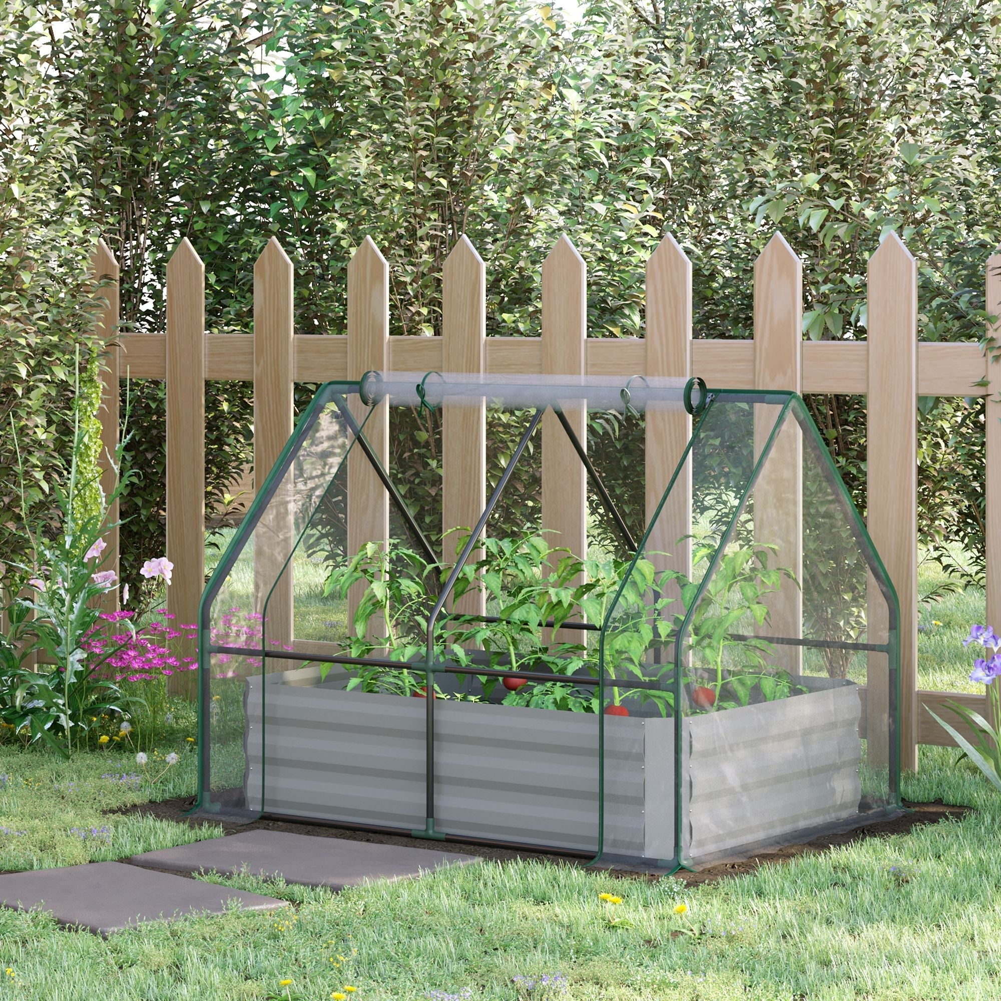 Green-framed outsourced raised garden bed with plastic cover and steel planter box housing green plants