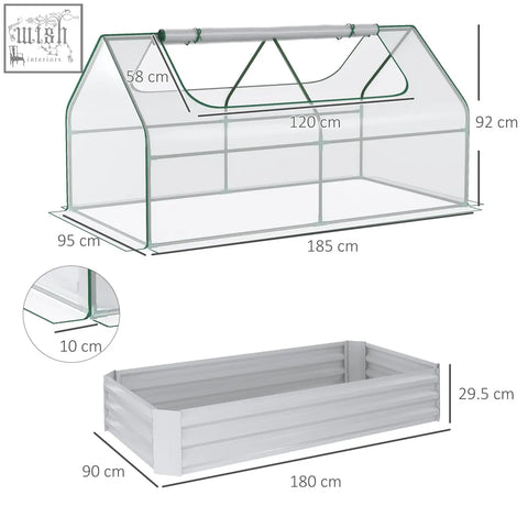 Clear plastic greenhouse with white metal frame and attached gray raised garden bed with plastic cover for growing plants