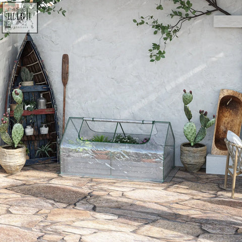 Outsunny raised garden bed with greenhouse features a green metal frame and clear plastic cover for growing vegetables and herbs