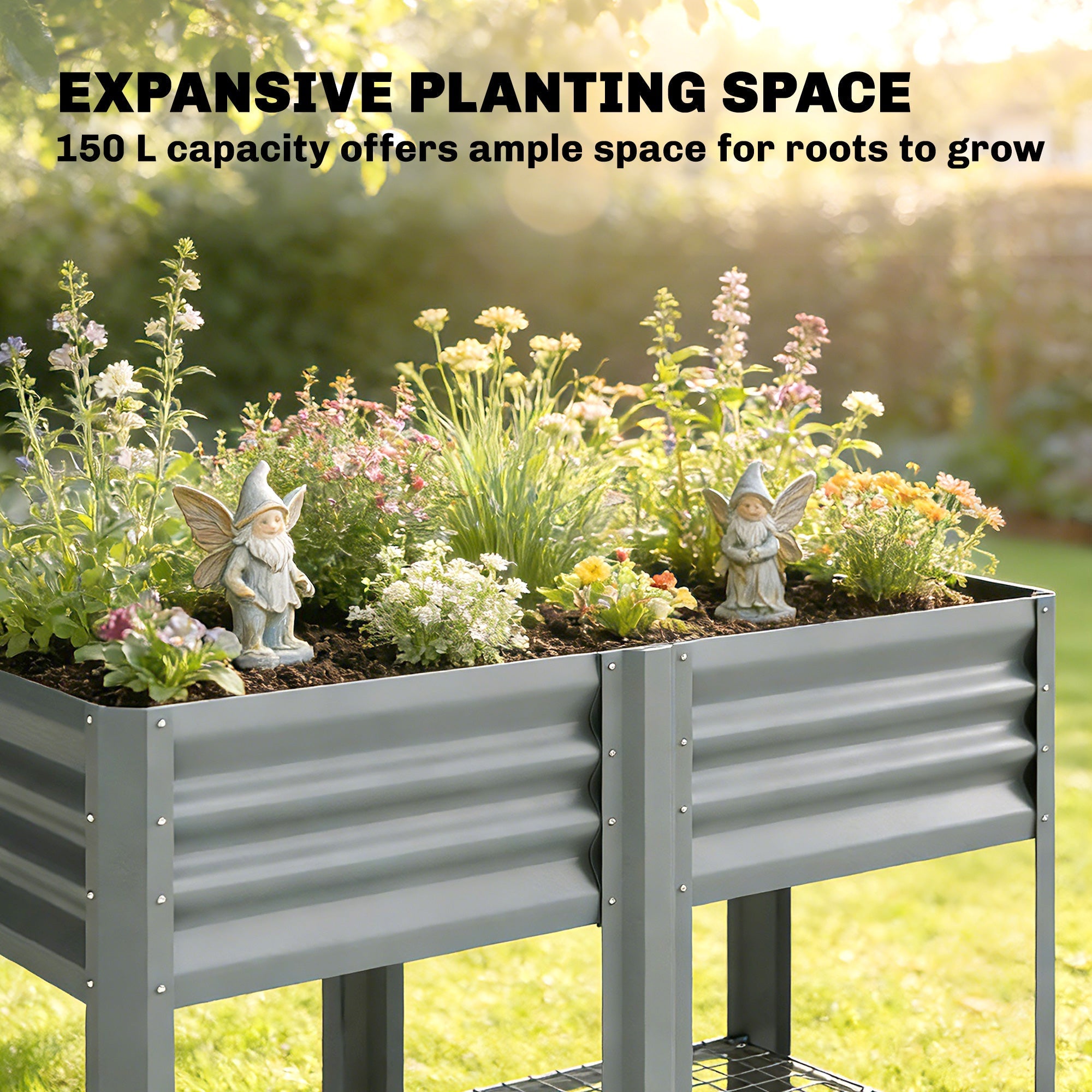 Gray corrugated metal outsunny raised planter box with legs featuring fairy figurines and colorful flowers for outdoor use