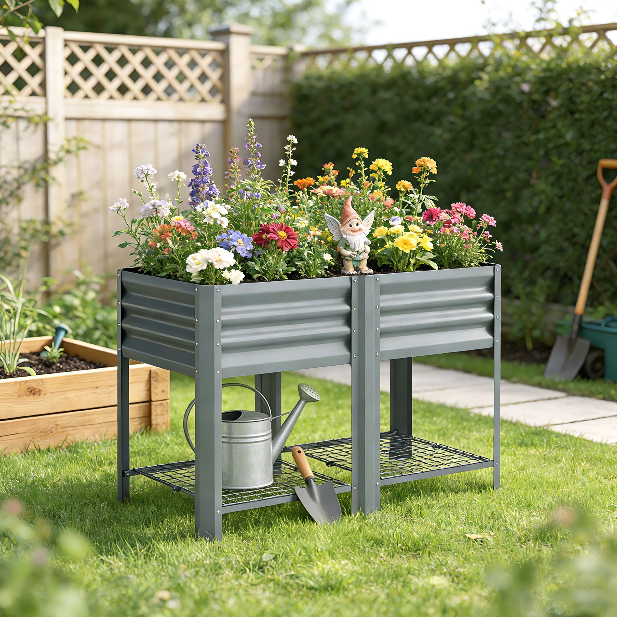 Gray corrugated metal outsunny raised planter with steel legs and lower wire shelf holding watering can and shovel