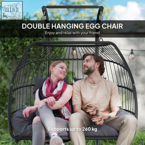 Black outsunny egg chair with chic rope woven frame removable headrests and dark grey padded cushions for indoor outdoor use