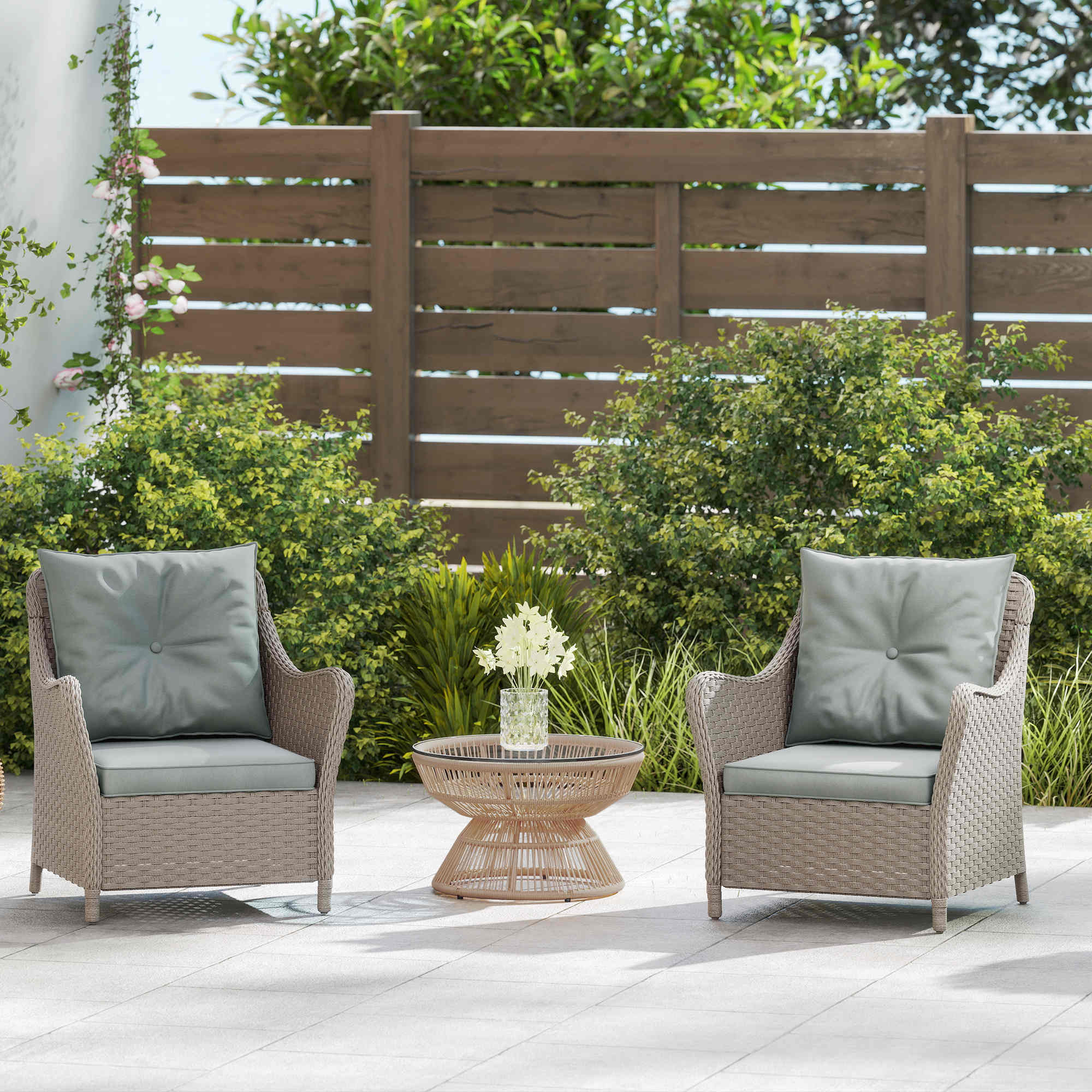 Beige rattan garden chair set with gray seat cushions and steel frame perfect for balcony or porch seating