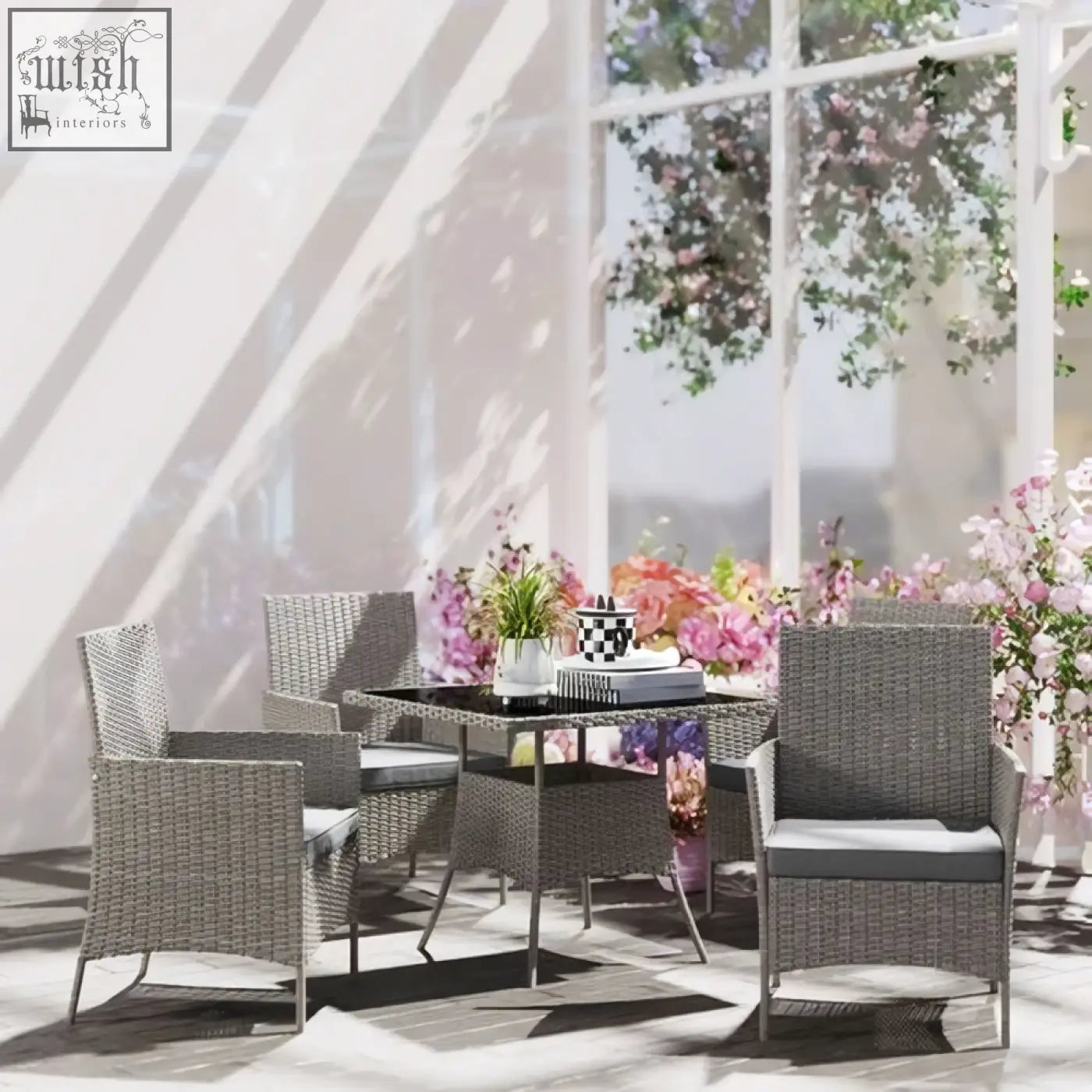 Gray woven wicker patio dining table set with light grey cushions and powder coated steel legs for outdoor use