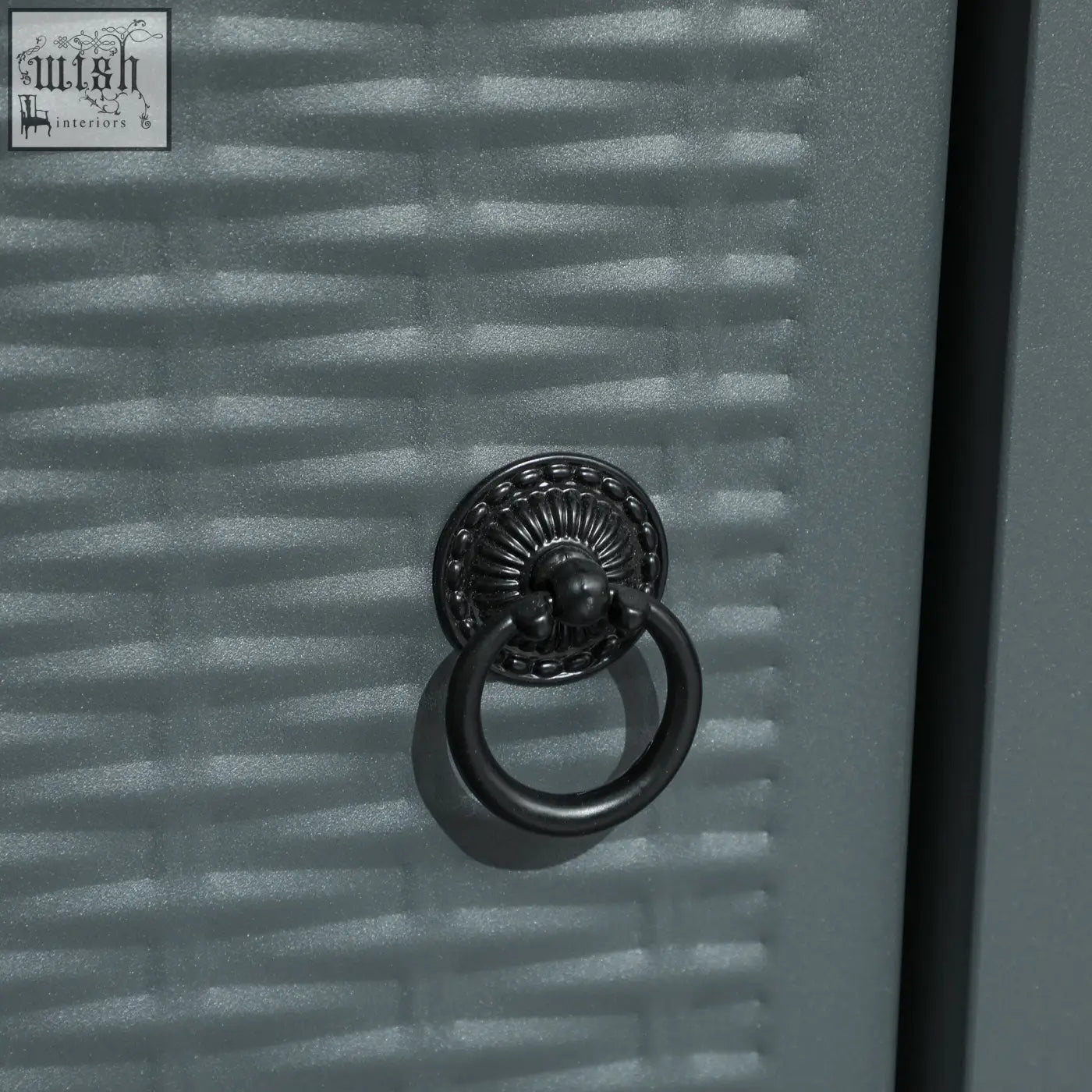 Black ornate metal ring pull on textured gray door complements outsunny rattan-style pit table with 40000 btu burner and mesh guard