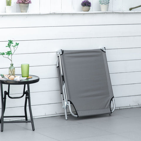 Gray fabric folding camping bed with silver frame and 4-position backrest perfect for outdoor activities and reclining sun lounger