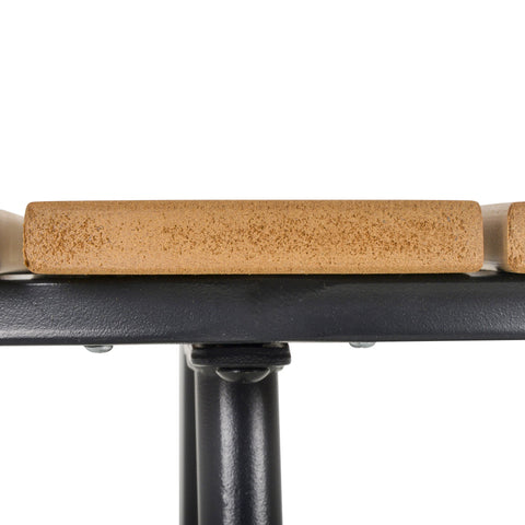 Brown cork handle resting on black solid steel frame of outsunny garden table with adjustable feet pad