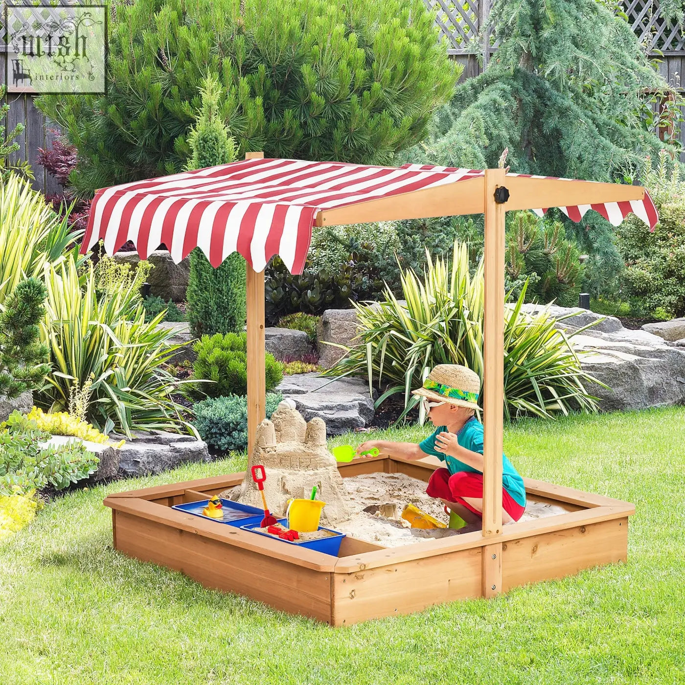 Wooden kids sandbox with red and white striped canopy features plastic basins and bottomless design for outdoor play