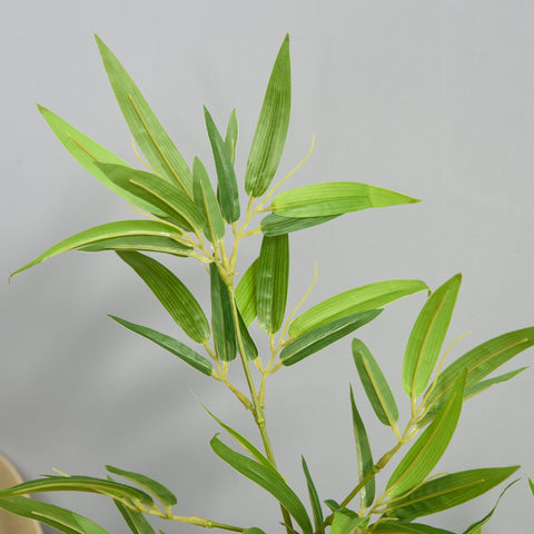 A vibrant green artificial bamboo tree with slender leaves and a natural stem in a heavy pot for indoor outdoor use
