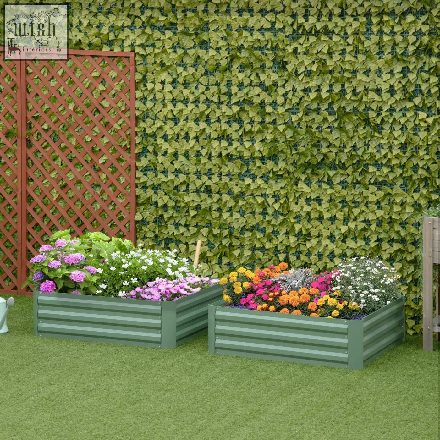 Two green galvanized metal raised garden beds filled with colorful flowers for flowers and herbs gardening