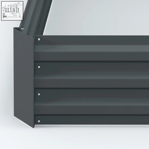 Dark grey metal garden bench with horizontal slats and screws next to Outsunny raised garden bed planter box