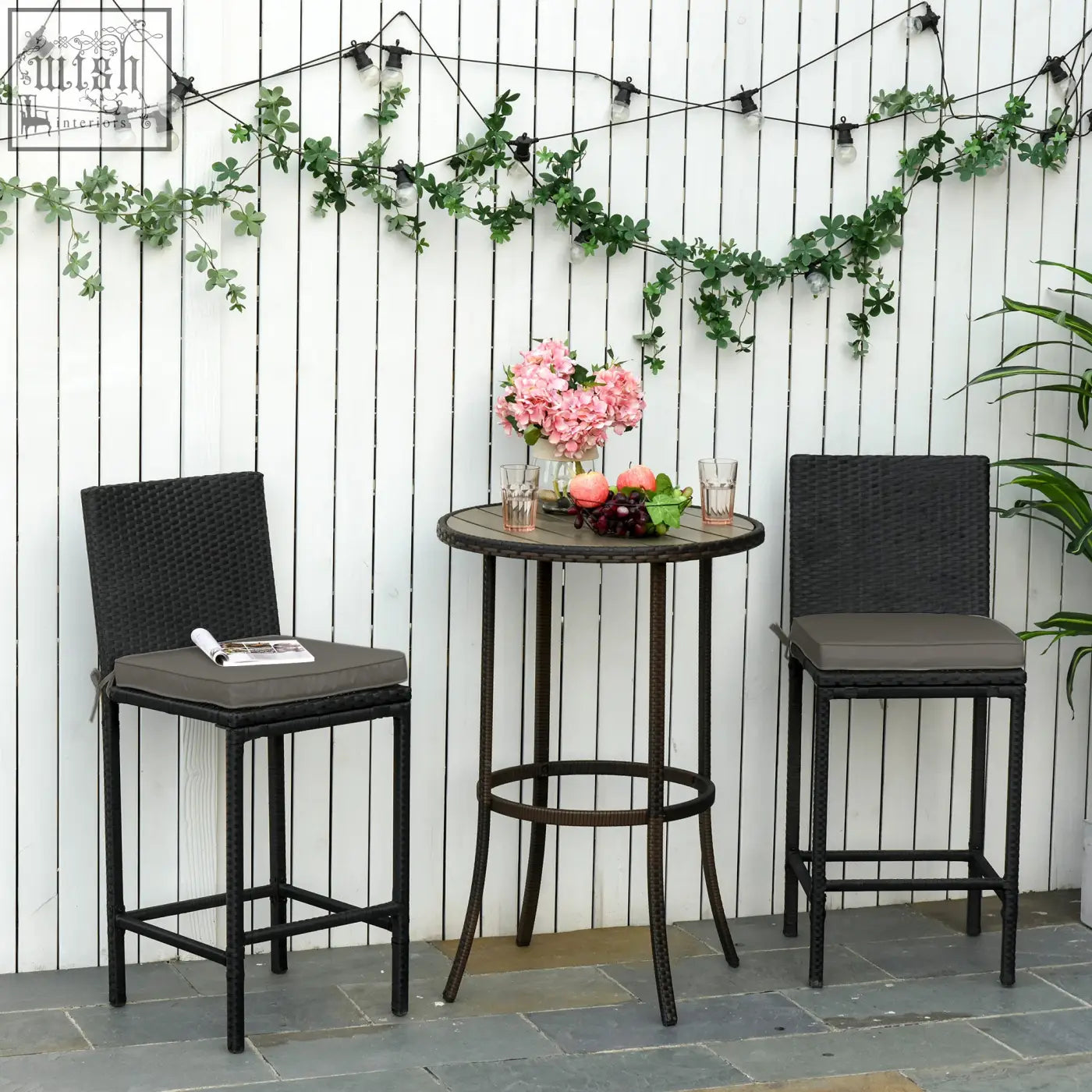 Black wicker bar table with round top and metal legs paired with dark grey polyester fabric covers featuring two tie fastenings for outdoor furniture