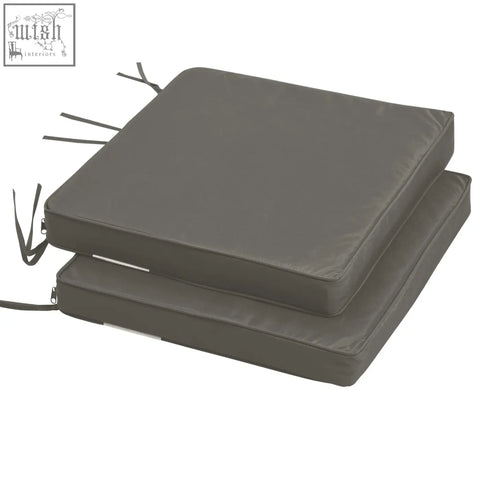 Dark gray outdoor cushion with polyester fabric covers and two tie fastenings for garden furniture use