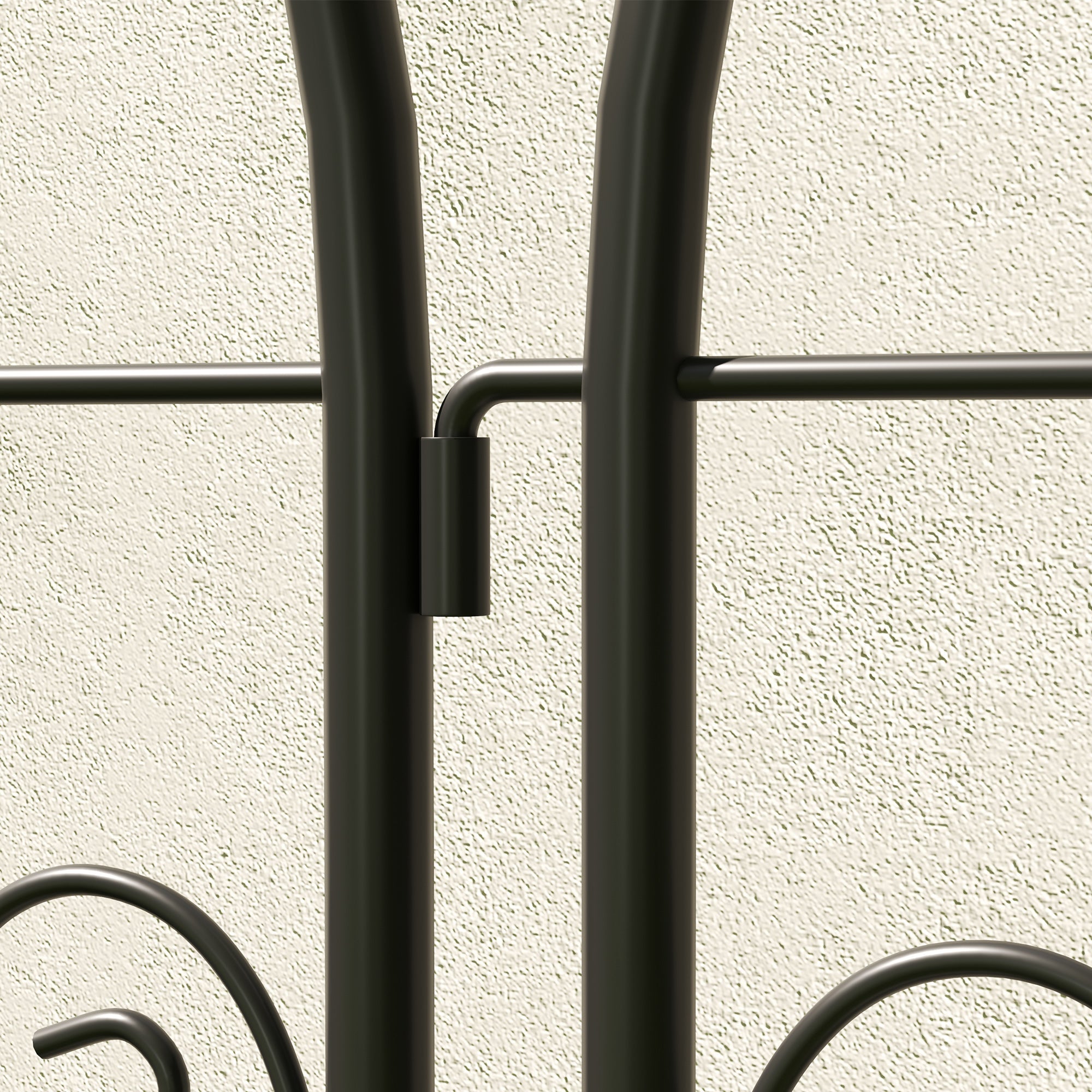 Black wrought iron coat rack with curved decorative elements and matte finish offering lots of space for climbing plants