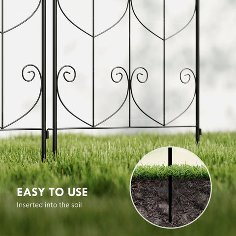 Black wrought iron two trellises with heart shaped scrollwork offer lots of support for climbing plants outdoors
