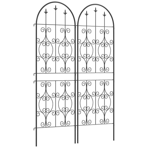 Black wrought iron garden gate with ornate scrollwork arched top pairs with two trellises that offer lots for climbing plants