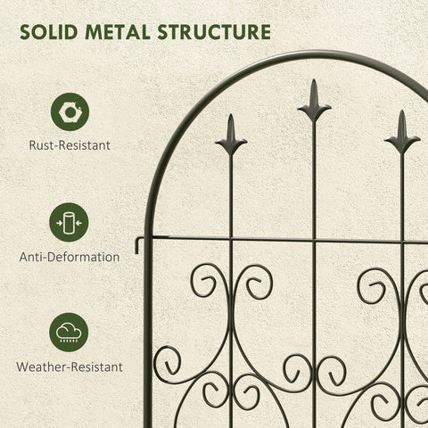 Black wrought iron garden gate with ornate scrollwork and pointed finials offers lots of support for climbing plants