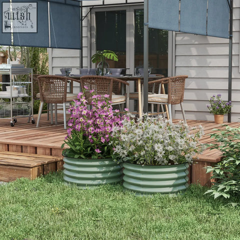 Two sage green galvanised steel planters with safety edging carry safely for direct contact vibrant flowers