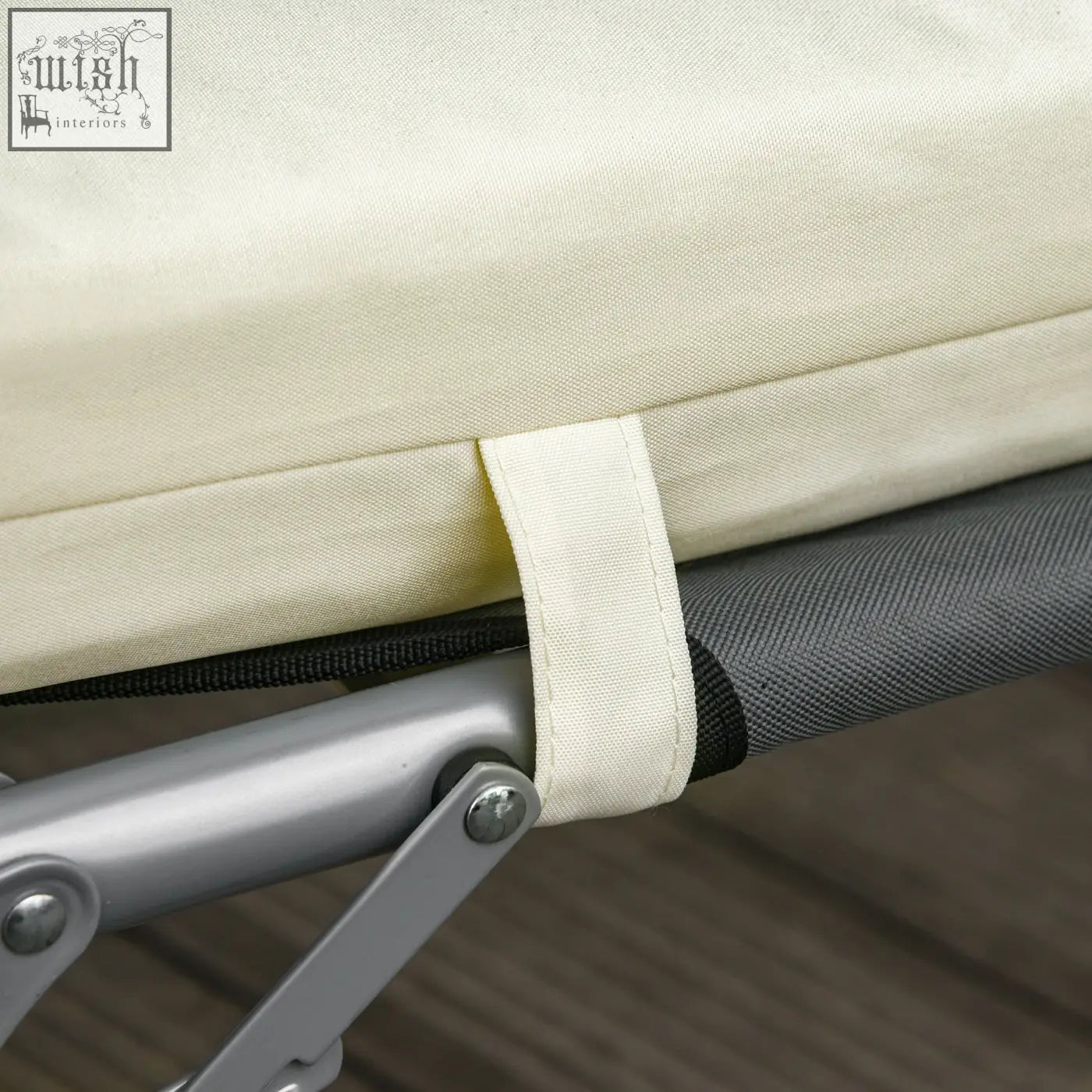 Beige canvas replacement cushion with black strap for rattan furniture made of cream white polyester fabric