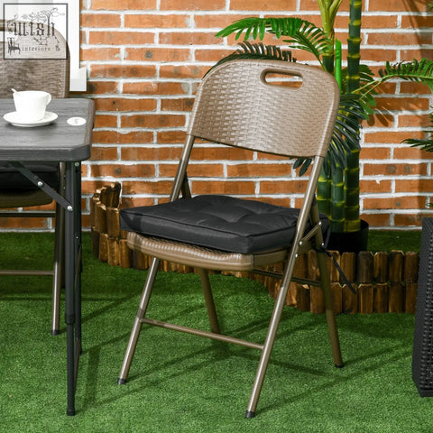 Brown woven wicker folding chair with black cushioned seat and two tie fastenings for outdoor seating comfort