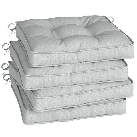 Stack of four outsunny light grey tufted outdoor seating cushions with two tie fastenings and light stains visible