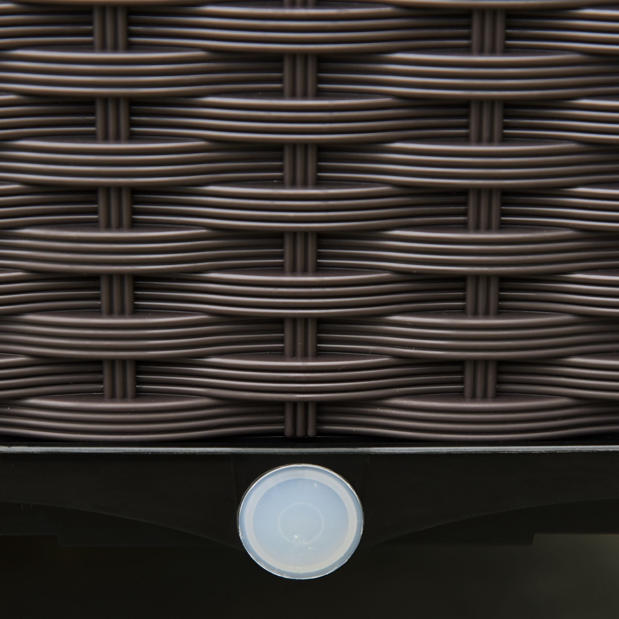Dark brown woven wicker surface with circular translucent sensor on the base of outsunny 6-pack raised planter box