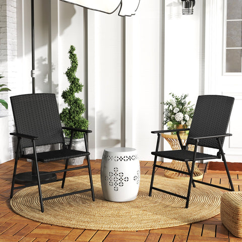 White ceramic garden stool with decorative black crosshatch pattern next to black foldable design rattan chair set