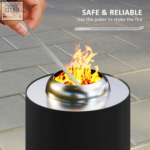 Silver stainless steel fire poker stoking flames in black powder-coated stainless outsunny smokeless fire pit