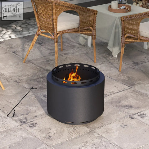 Black metal outsunny smokeless fire pit with perforated top and flame burning inside for high heat and secondary combustion