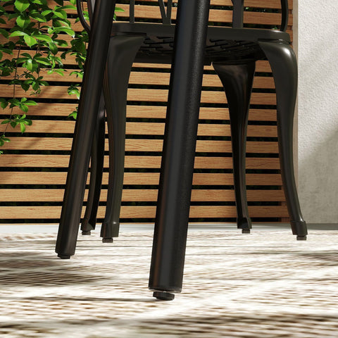 Black metal patio chair with curved legs and slatted backrest next to outsunny black garden table with powder-coated steel frame