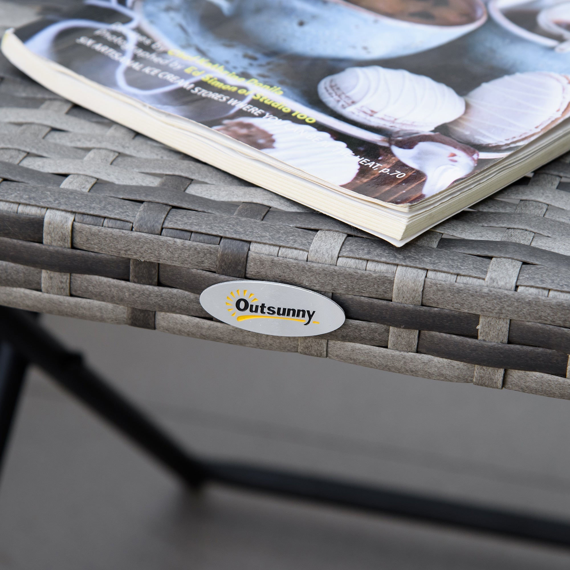 Gray woven resin folding table with steel frame and subtle texture featuring an oval outsunny brand sticker