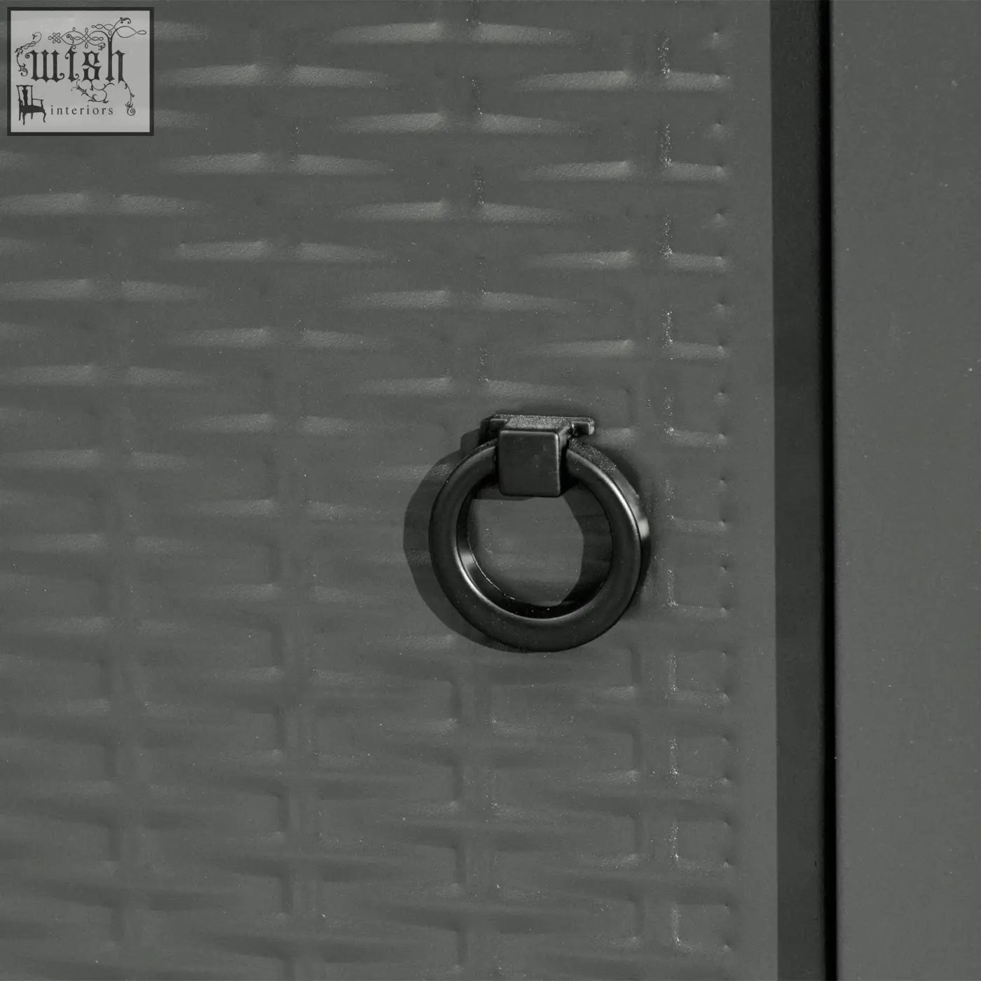 Black metal ring pull on gray woven plastic door of outsunny black rattan pit table with lava rocks and propane tank storage