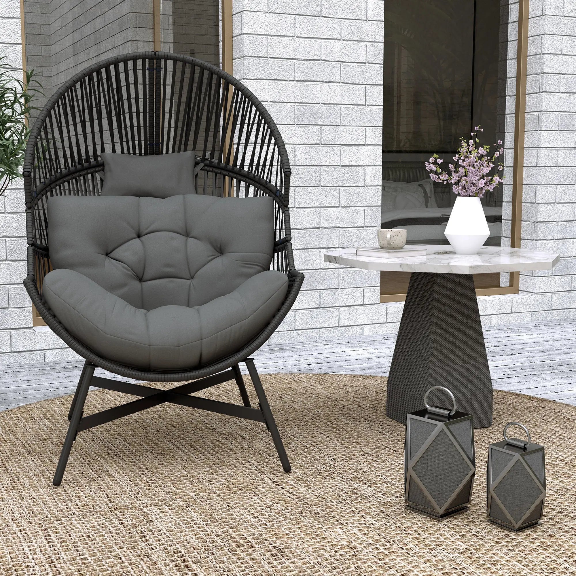 Black rattan egg chair with gray cushion and powder-coated steel frame perfect for outdoor use